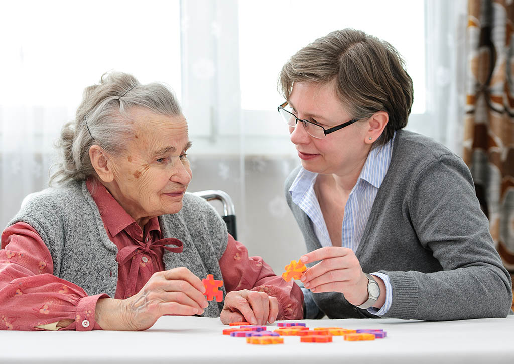 Caregiver supporting an older adult at home